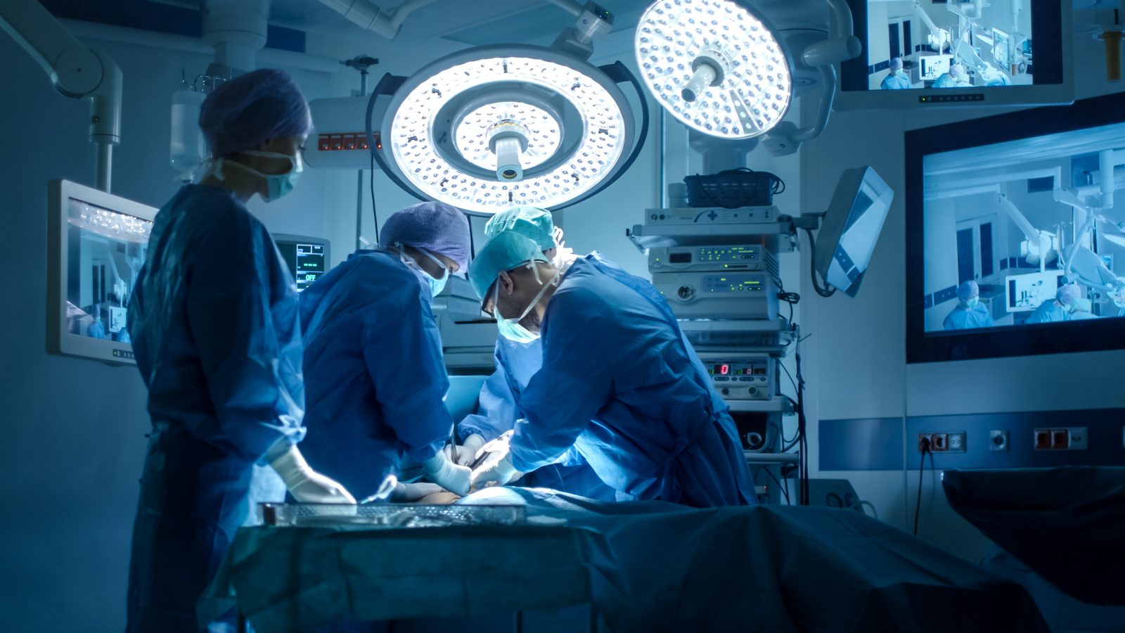 Medical SEO Surgical team operating under lights in a modern operating room